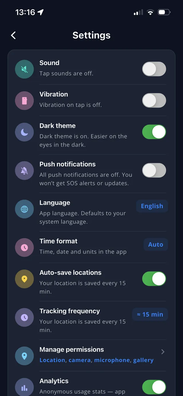 Settings screen in dark theme — theme, language, push notifications, tracking frequency and permissions